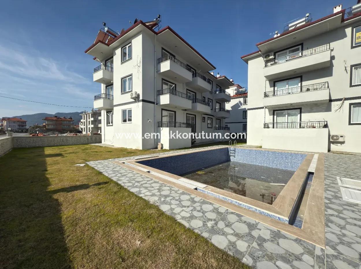 1 1 55M2 Brand New Apartment For Sale In A Complex With Pool Close To Ortaca Center.