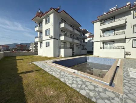 1 1 55M2 Brand New Apartment For Sale In A Complex With Pool Close To Ortaca Center.